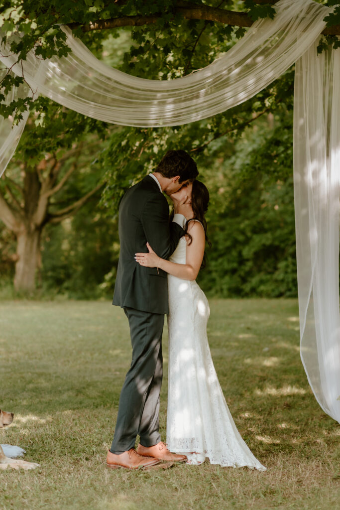 The groom kissing his new wife!